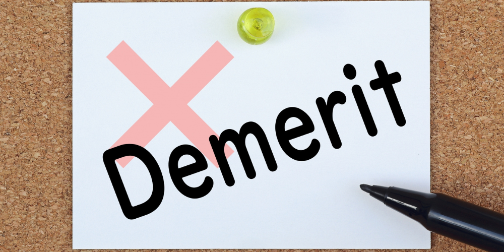 Demeritの文字と赤いバツ印